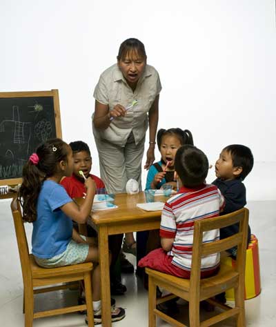 Teacher with students in a Head Start setting.