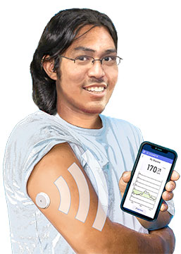 A man wearing a Continuous Glucose Monitor