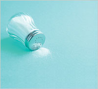 A tipped over salt container
