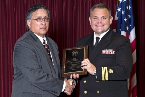 Lt. Cmdr. Matthew Ellis receives the 2016 Gary J. Gefroh Safety and Health Award from Dean Seyler, IHS Portland Area director. Ellis was recognized for his significant contribution to healthcare safety and infection control.