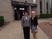 Thumbnail - clicking will open full size image - Secretary Sebelius and Dr. Roubideaux in front of the Navajo Area Office