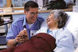 A health care provider comforts a patient