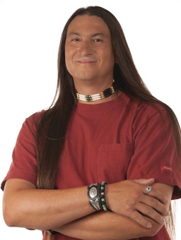 Native-American man smiling with arms crossed