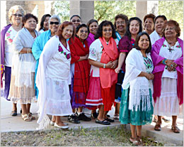 Group of senior women in traditional dress.