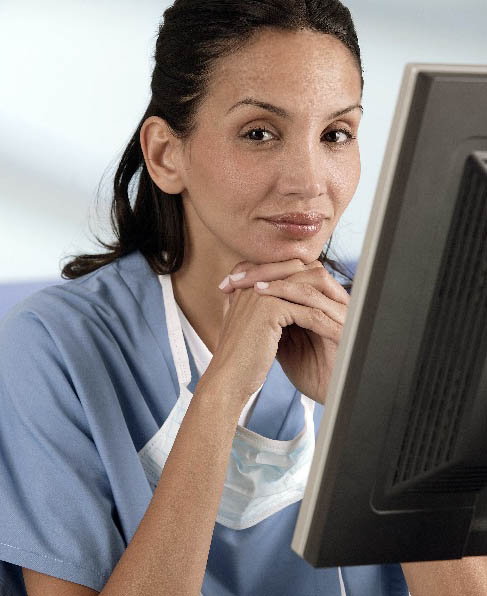 A doctor sitting in front of a monitor