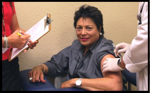 Photo image of Margo Kerrigan getting her flu shot