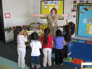 LTJG Weidley with a group of children.