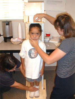 child being measured