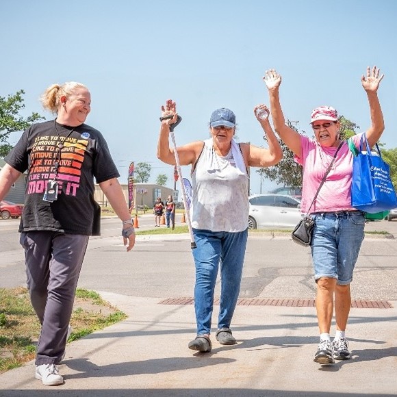 Three elder women walking