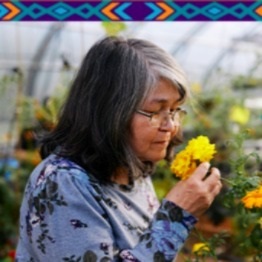 Woman smelling a flower