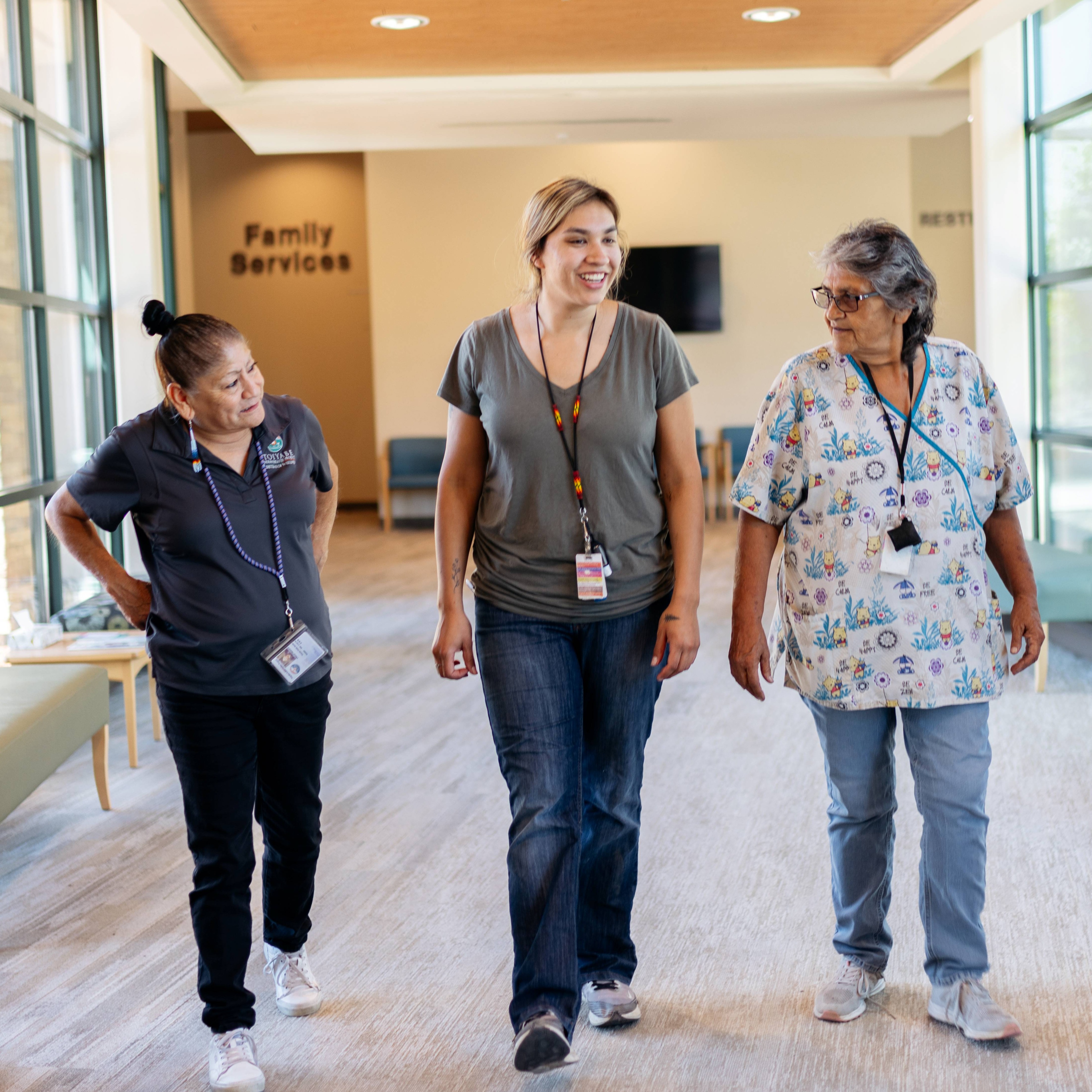 nurses walking in a hallway