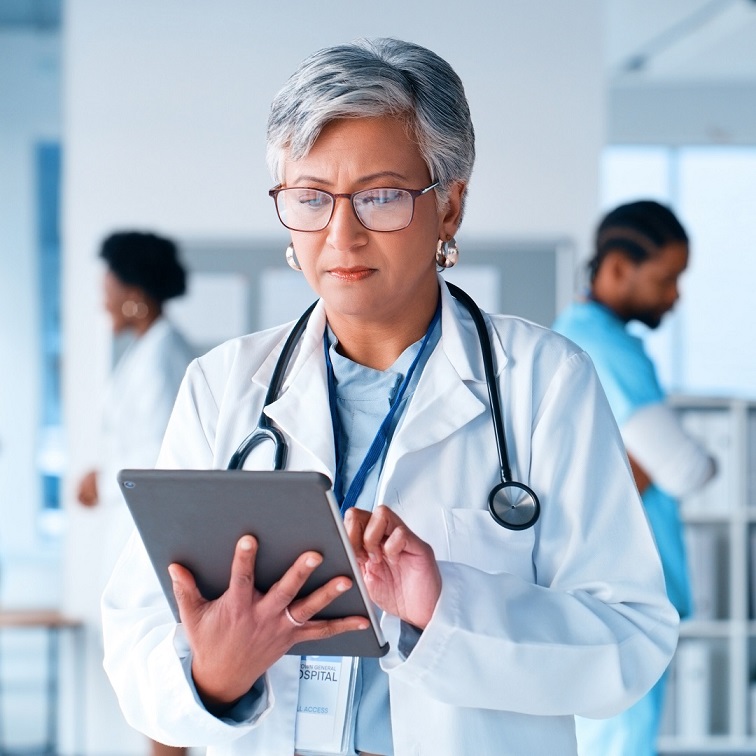 A doctor using a tablet in a clinic