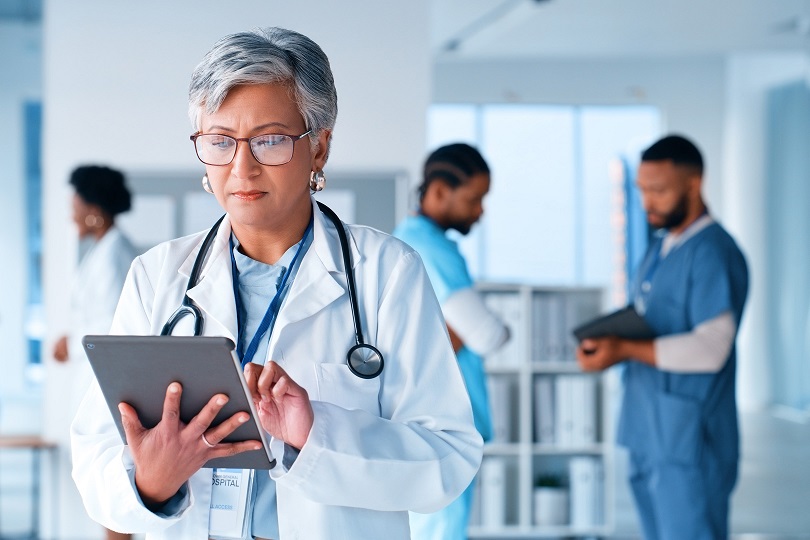 Doctor using a tablet in a clinic