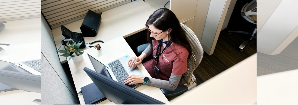 woman sitting at a cubicle