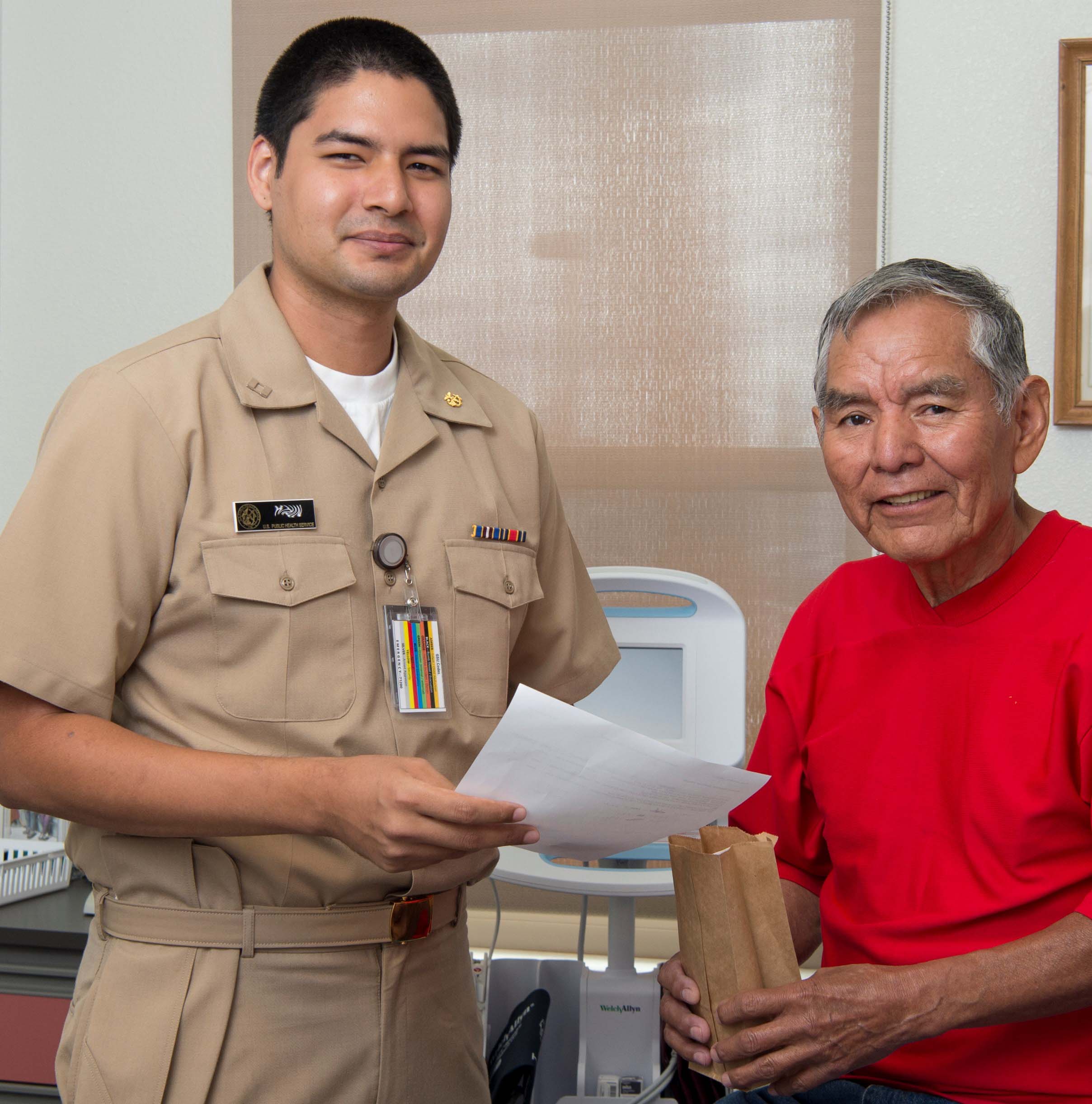 Medical professional with elder patient