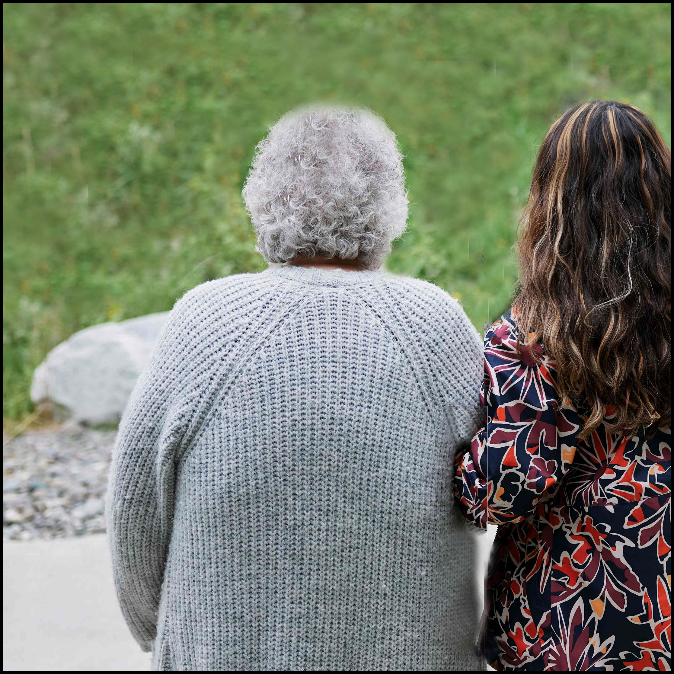 Elder walking with caregiver