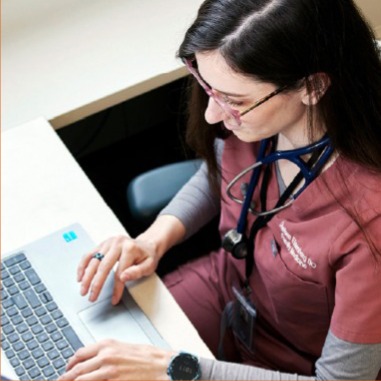Woman typing on keyboard