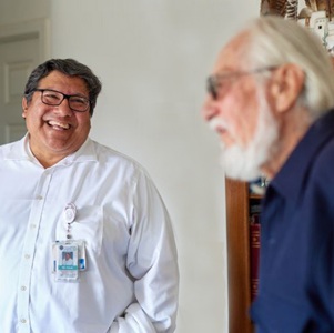 Health worker visiting patient at home