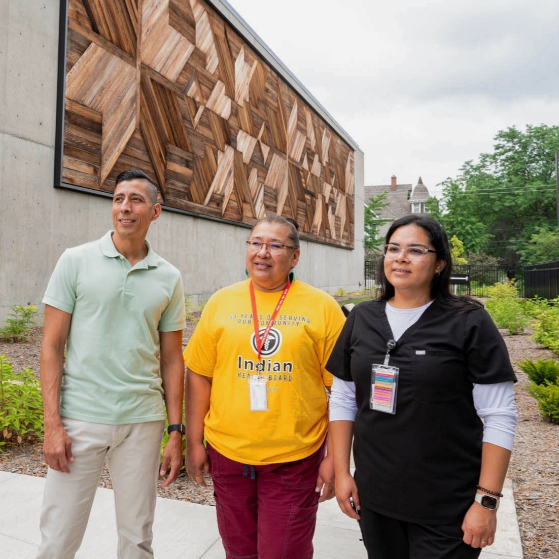 staff in front of center