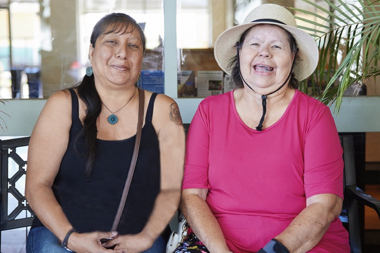 Two women sitting on a bench