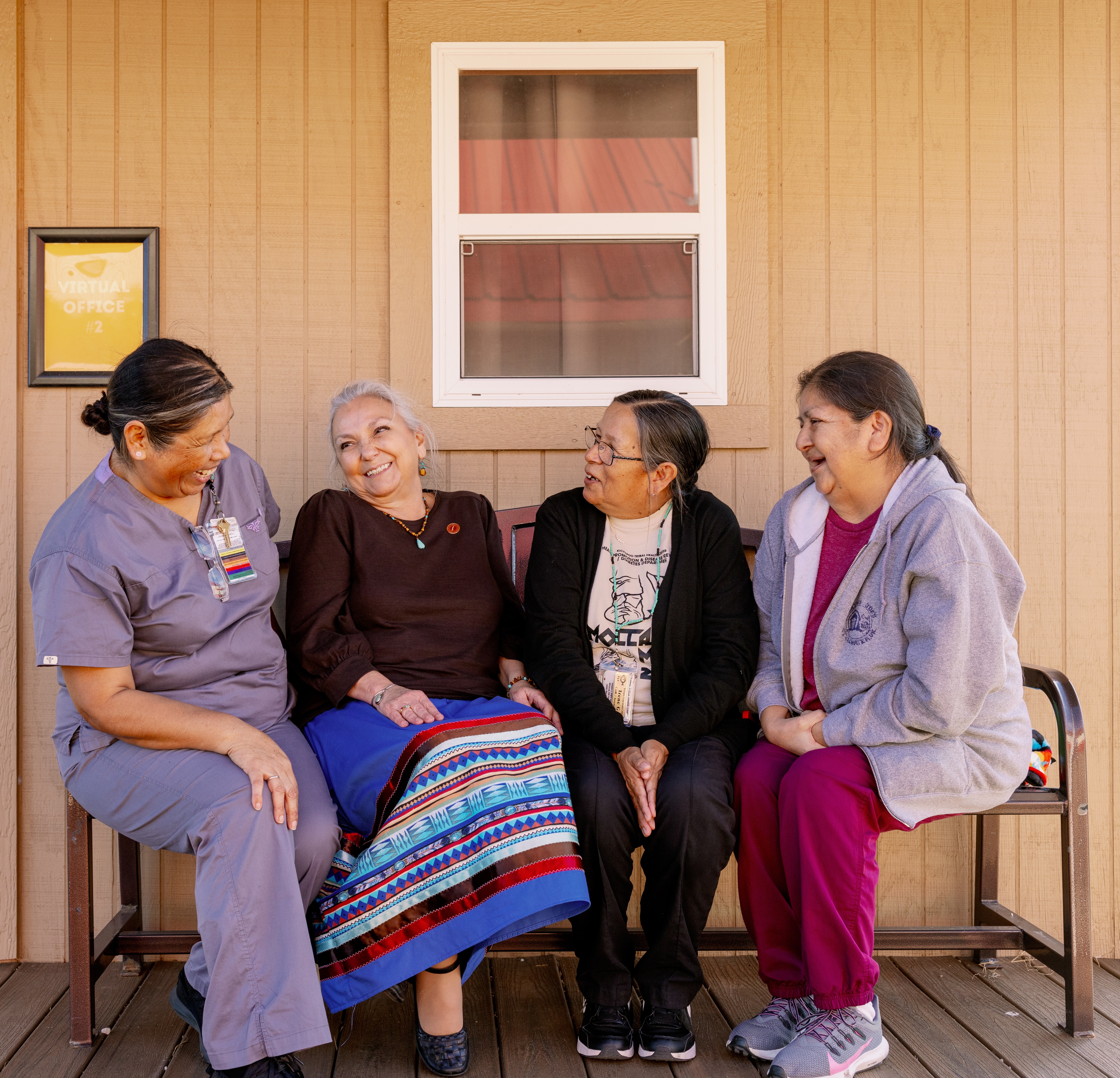 Clinic CHR staff sitting on a bench