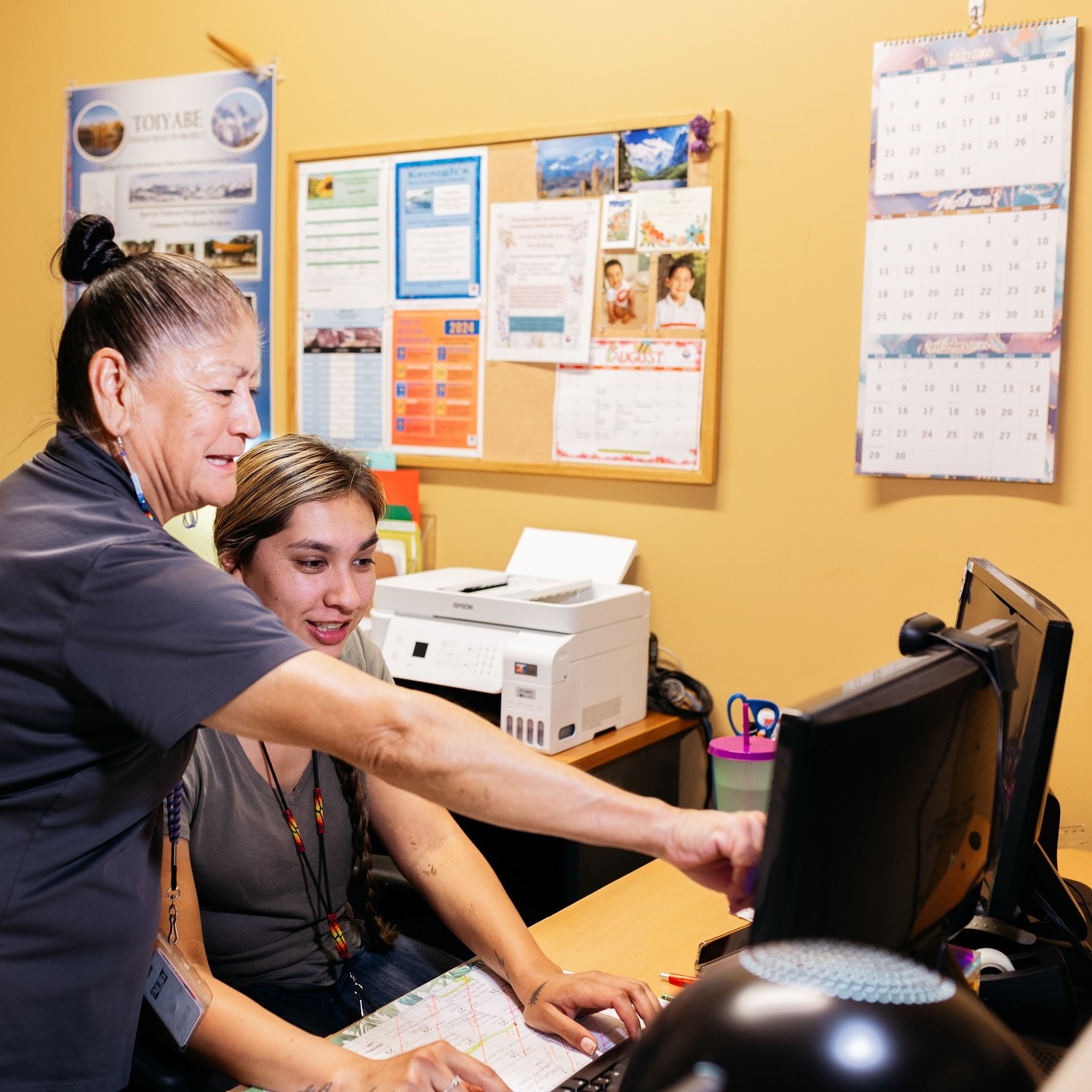 Clinic employees at computer