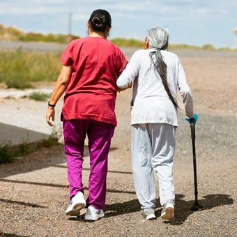 patient and caregiver walking