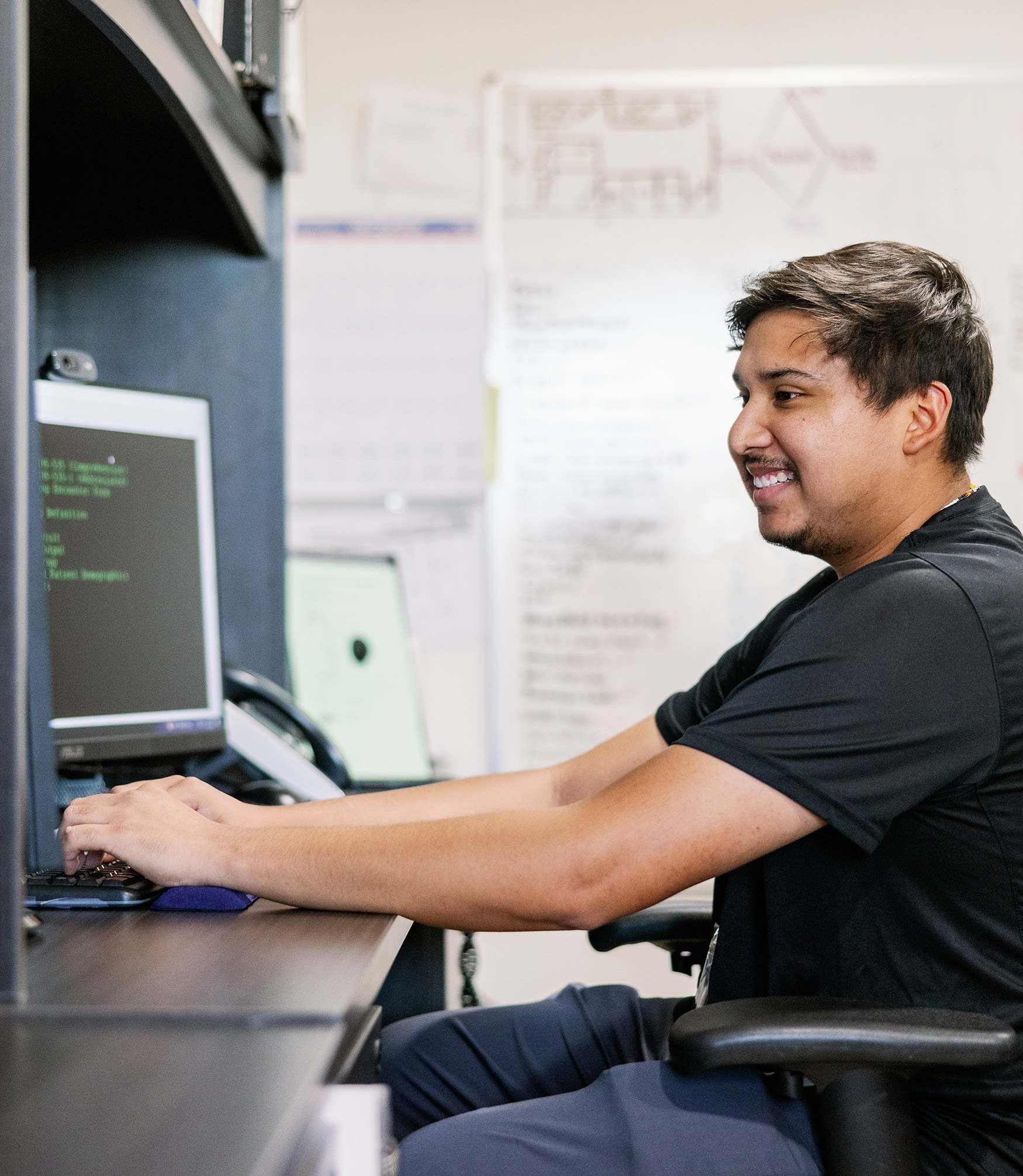 Clinic employee at computer