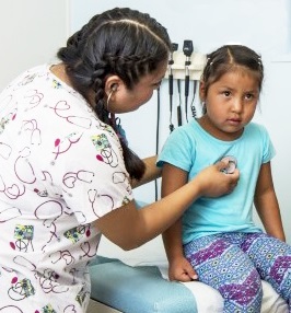 A little girl getting a checkup.