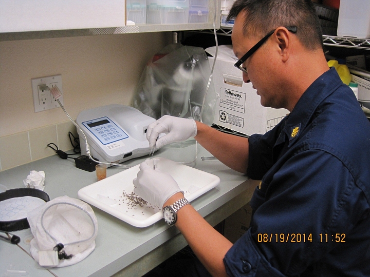 CDR Michael Box testing welding exhaust ventilation at the Alaska Native Medical Center