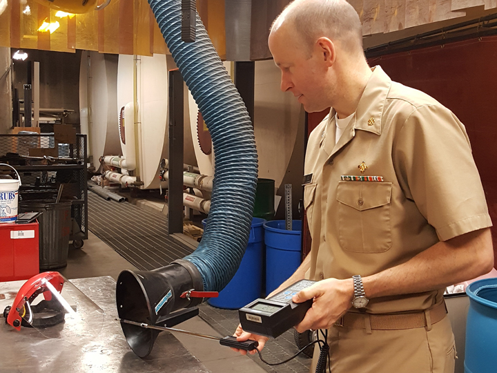 CDR Michael Box testing welding exhaust ventilation at the Alaska Native Medical Center