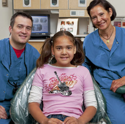 Photo of Dental Professionals with a Patient