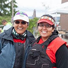 Two women smiling after a physical activity
