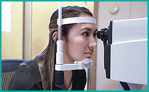 A woman getting an eye exam.