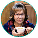 A woman drinking soup