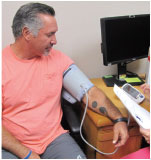 A man getting getting his blood pressure checked.