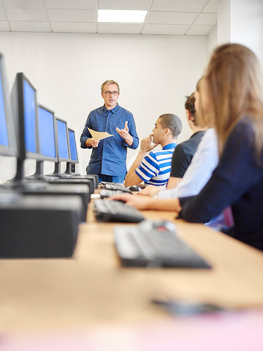 Male instructor teaching a class