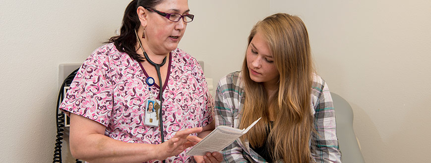 Nurse reviewing instruction with patient