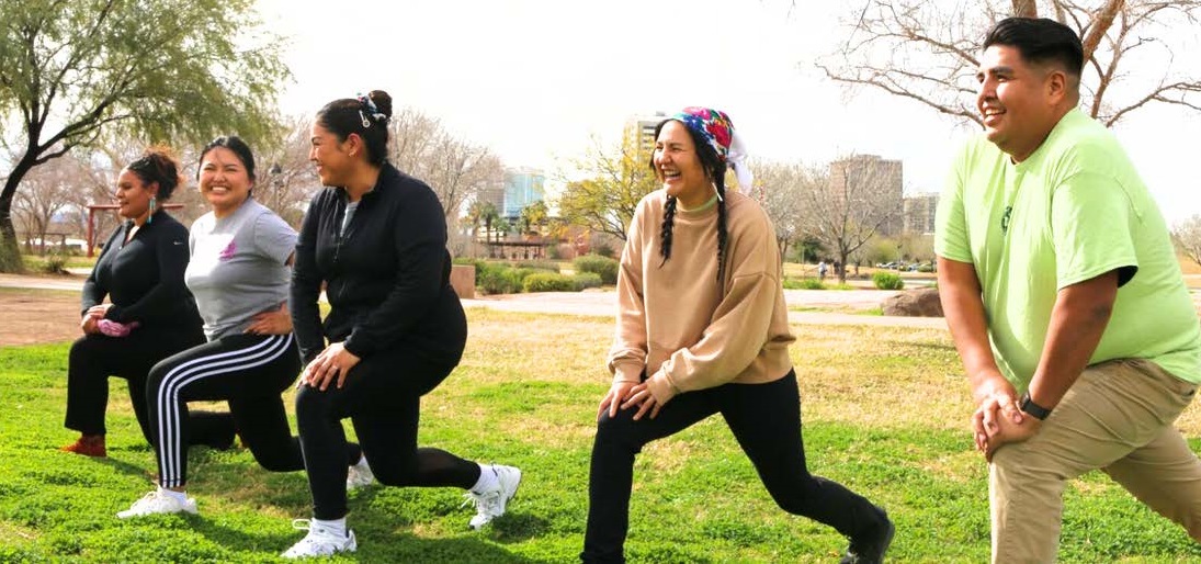 People stretching outdoors