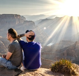 Two men watching sunset