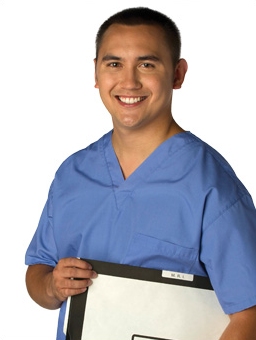 Doctor wearing blue scrub smiling