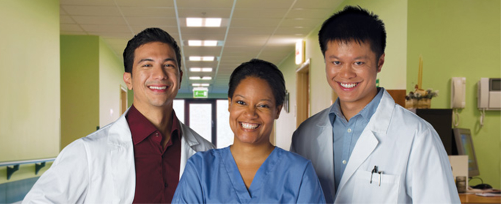 Three doctors smiling