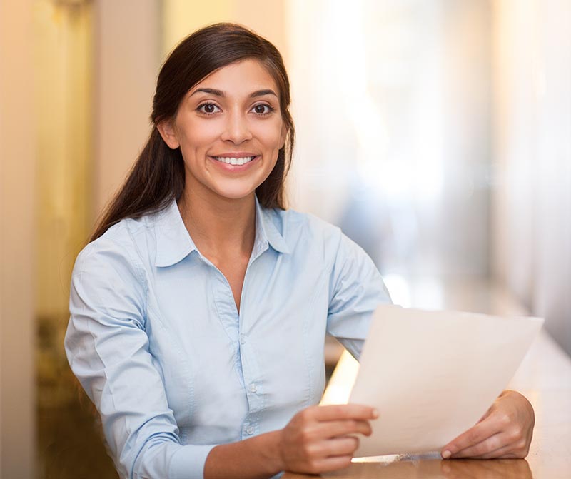 Young woman holding paper