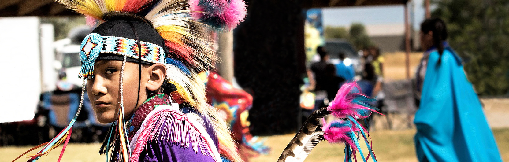 A young native american man in traditional costume