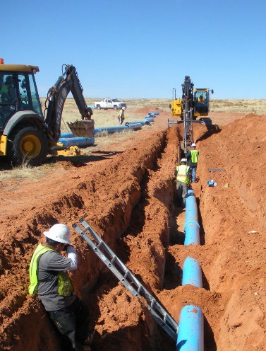 Sanitation engineers installing pipelines