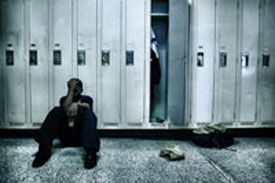 boy sitting at the lockers