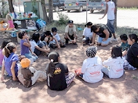 children interacting in a garden