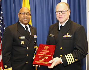 Capt. Steven Raynor, Acting Deputy Director of the IHS Headquarters Division of Facilities Planning and Construction, receives the IHS Engineer of the Year Award from Rear Adm. Randall Gardner.