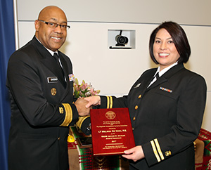 Lt. Melissa de Vera, IHS Bemidji Area field engineer, receives the Rear Adm. Jerrold M. Michael Award from Rear Adm. Randall Gardner. The award recognizes outstanding leadership and dedication to the education, training and/or mentoring of present and future USPHS engineers.