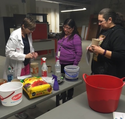 Red Lake IHS staff participate in a gardening demonstration